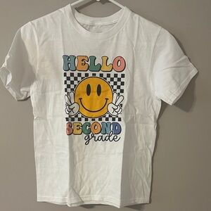 White Graphic Tee with Smiley and Text Design